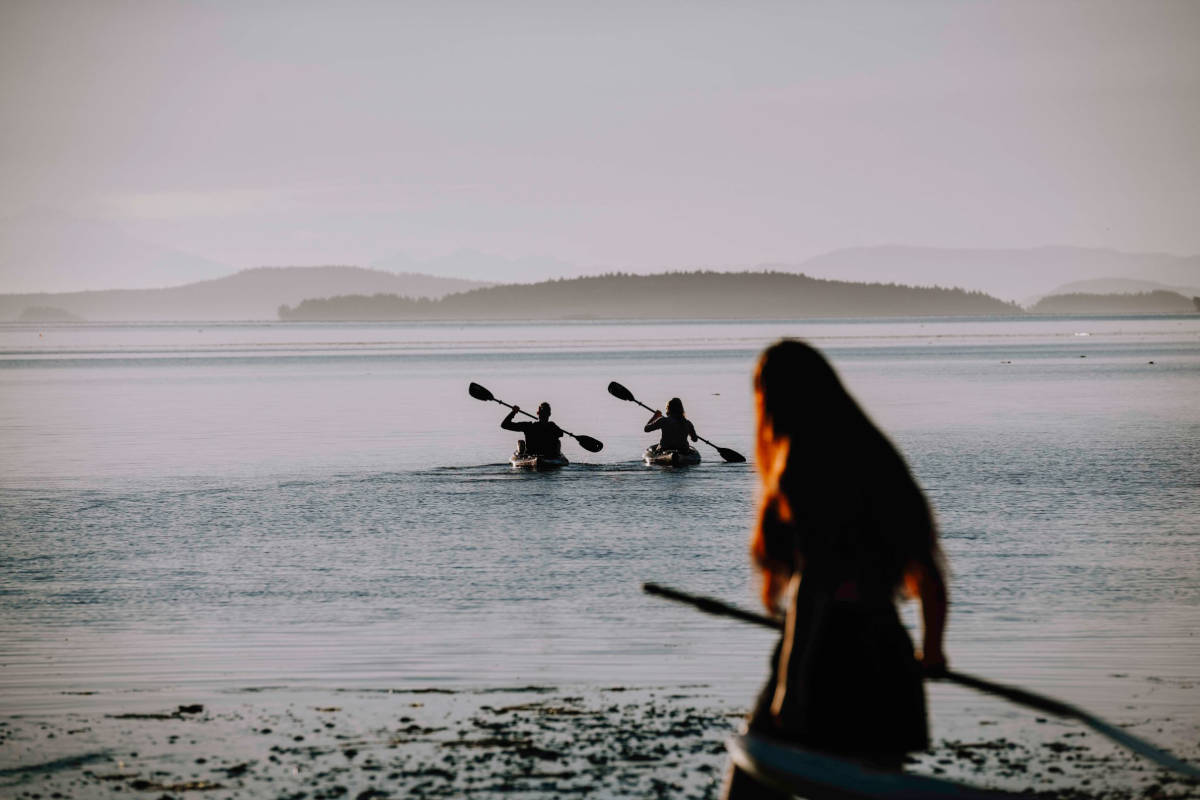 People Kayaking off the Beach at Anderson Lane